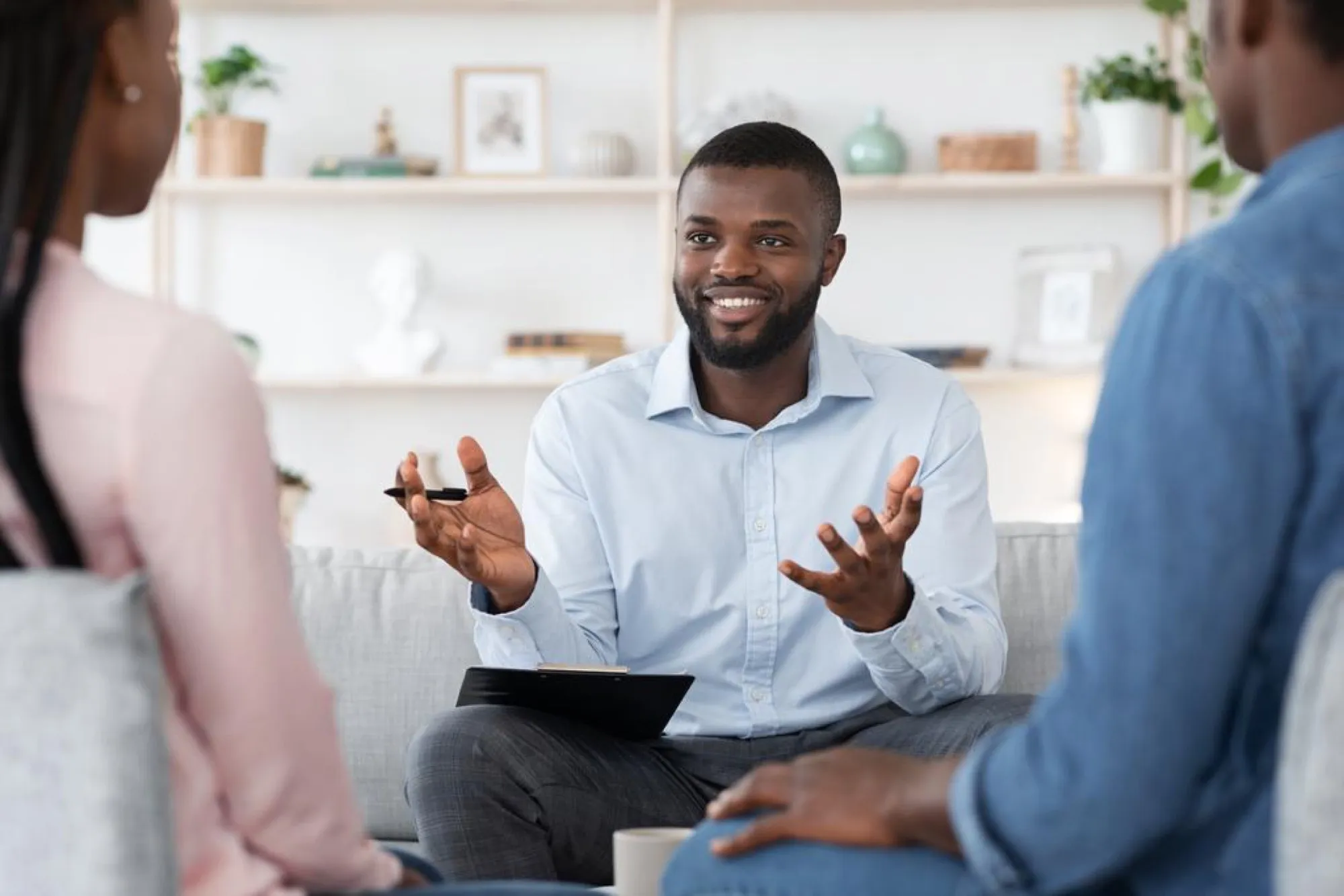 A counselor talking with a client in a bright office