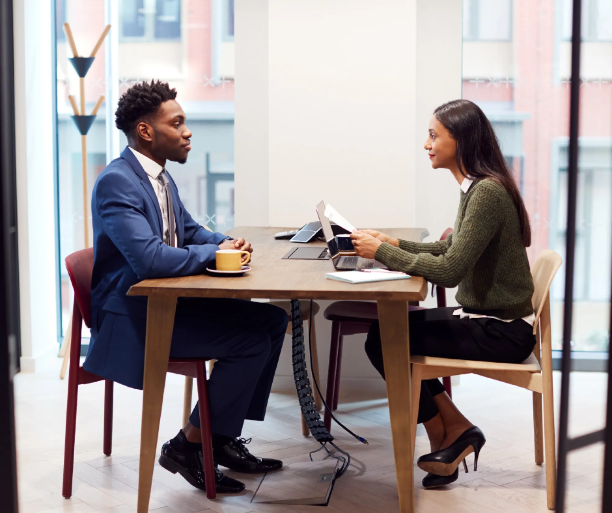 A job candidate in an interview across a desk