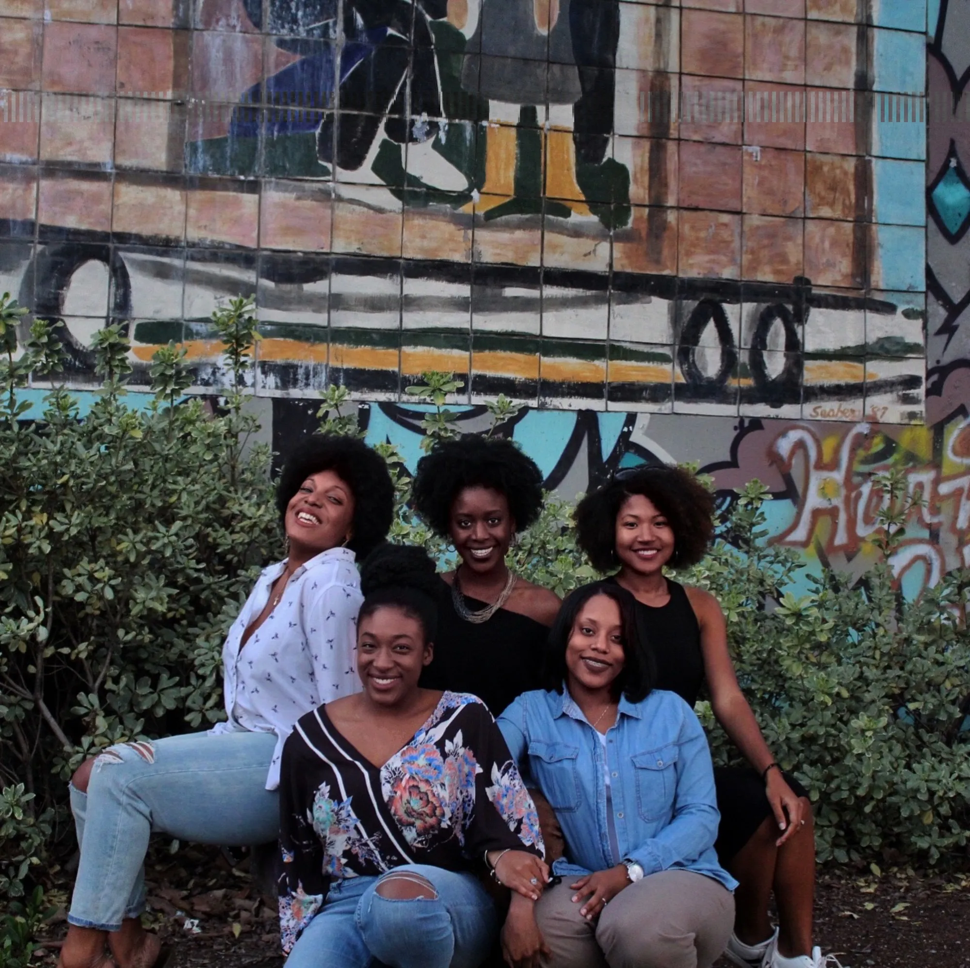 A group of young women talking together outdoors